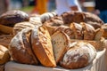 Fresh bread at a farmers market. Loaves of bread displayed in basket. Generative AI Royalty Free Stock Photo