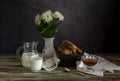The fresh bread, honey and milk and a vase with white daisies Royalty Free Stock Photo