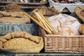 Fresh bread with pastry in the wicker basket and grain in the ba Royalty Free Stock Photo