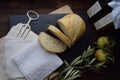 Fresh Bread on Rustic Table with Linen Napkins