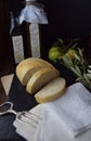 Fresh Bread on Rustic Table with Linen Napkins