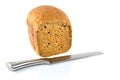 Fresh bread slice and a bread knife isolated on white background. Royalty Free Stock Photo