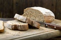 Fresh bread slice  on rustic table Royalty Free Stock Photo