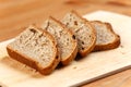 Fresh bread slices on rustic wooden board Royalty Free Stock Photo