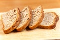 Fresh bread slices on rustic wooden board Royalty Free Stock Photo