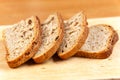 Fresh bread slices on rustic wooden board