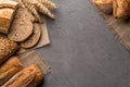 Bread background with wheat, aromatic crispbread with grains, copy space, top view. Brown and white whole grain loaves still life Royalty Free Stock Photo