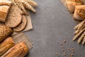 Bread background with wheat, aromatic crispbread with grains, copy space, top view. Brown and white whole grain loaves still life Royalty Free Stock Photo