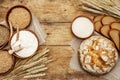 Fresh bread with wheat ears and a bowls of flour and grain Royalty Free Stock Photo