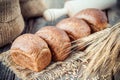 Fresh bread, wheat ears, sack of flour and rolling pin. Royalty Free Stock Photo