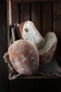 Fresh bread in a wooden box.Italian bread ciabatta or bun. Freshly baked traditional bread.Small depth of field Royalty Free Stock Photo