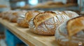 Fresh bread on wooden shelf, bakery display Royalty Free Stock Photo