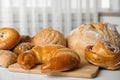 Fresh breads and pastries on white table Royalty Free Stock Photo