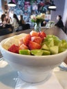 Fresh breakfast bowl with strawberries, apple, banana, cereals and yoghurt