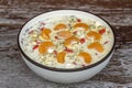 Fresh breakfast of granola, yogurt, nuts, goji berries, chia seeds and mandarin. Muesli with fruits and berries in bowl on a Royalty Free Stock Photo