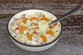 Fresh breakfast of granola, yogurt, nuts, goji berries, chia seeds and mandarin. Muesli with fruits and berries in bowl on a Royalty Free Stock Photo