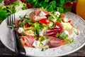 Fresh breakfast Omelette Salad with Parma Ham, feta cheese and vegetables.