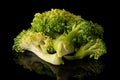 Fresh breen broccoli isolated on black glass Royalty Free Stock Photo