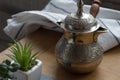 Fresh breved coffe in cezve, traditional turkish coffee pot, cup of coffee, succulent Royalty Free Stock Photo