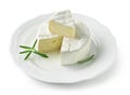 Fresh brie cheese on white plate Royalty Free Stock Photo