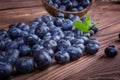 Fresh and bright blueberry in a wooden crate, close-up. Healthy, ripe, raw and bright dark blue berries on a wooden background. Royalty Free Stock Photo