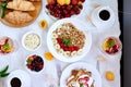 Fresh and bright continental breakfast table, abundance healthy meal variety