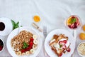 Fresh and bright continental breakfast table, abundance healthy meal variety crunch cereal, french toast, fruits, lemonade, coffee Royalty Free Stock Photo
