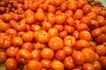 Fresh bright red tomatoes in bulk. Vegetables, fruits