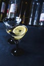 Alcohol cocktail with splash.Dry martini with black olives.Vermouth cocktail inside martini glass over dark background.Martini gla Royalty Free Stock Photo