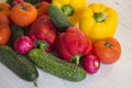 Fresh bright vegetables on a wooden table