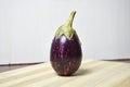 Fresh brinjal vegetable on chopping board