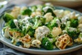 Fresh broccoli and cauliflower salad with Tahini dressing on plate Royalty Free Stock Photo