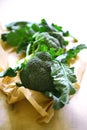 Fresh broccoli leaves on paper Royalty Free Stock Photo