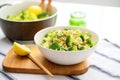 fresh broccoli rice in white bowl, wooden spoon beside it Royalty Free Stock Photo