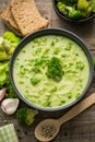Fresh broccoli soup on the wooden table Royalty Free Stock Photo