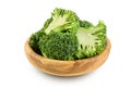 fresh broccoli in wooden bowl isolated on white background close-up with full depth of field.