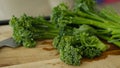 Fresh Broccolini vegetables on a cutting board