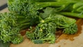 Fresh Broccolini vegetables on a cutting board