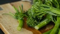 Fresh Broccolini vegetables on a cutting board