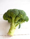 Fresh brocoli on a white wooden background Royalty Free Stock Photo