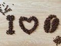 Fresh brown arabica coffee beans, seductive aroma Were arranged in alphabetical order. I love coffee with the logo. Royalty Free Stock Photo