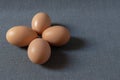 Fresh brown chicken eggs on grey background. Royalty Free Stock Photo