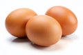 Fresh Brown Eggs A CloseUp Studio Shot of Three Whole Eggs on a Pristine White Background for Culinary Royalty Free Stock Photo