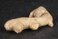 Fresh brown ginger on grey stone Royalty Free Stock Photo