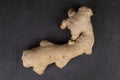 Fresh brown ginger on grey stone Royalty Free Stock Photo