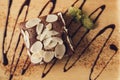 Fresh brownie sweet healthy food. delicious tasty chocolate cake with almond flake decoration on wooden plate