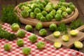 Fresh brussel sprouts on wooden board