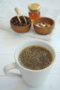 Fresh bubble hot black coffee in pure white ceramic cup on white wooden table, coffee love concept, copy space