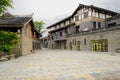 Fresh built tile-roofed buildings along stone street in cloudy a