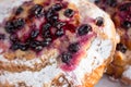 Fresh bun with black currant close-up